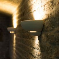 Detail photo of an indirect lighting at the brick wall in the interior area